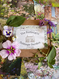 The Nostalgic Cottage Garden Flower Box - 12 Packs by Bishy Barnabees Cottage Garden features heritage seeds and assorted fresh blooms, beautifully arranged atop vibrant cottage garden photos for a bright, rustic display.