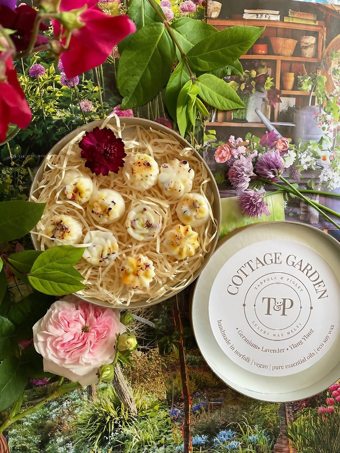 Cottage Garden Botanical Wax Melts arranged on a table with a floral backdrop