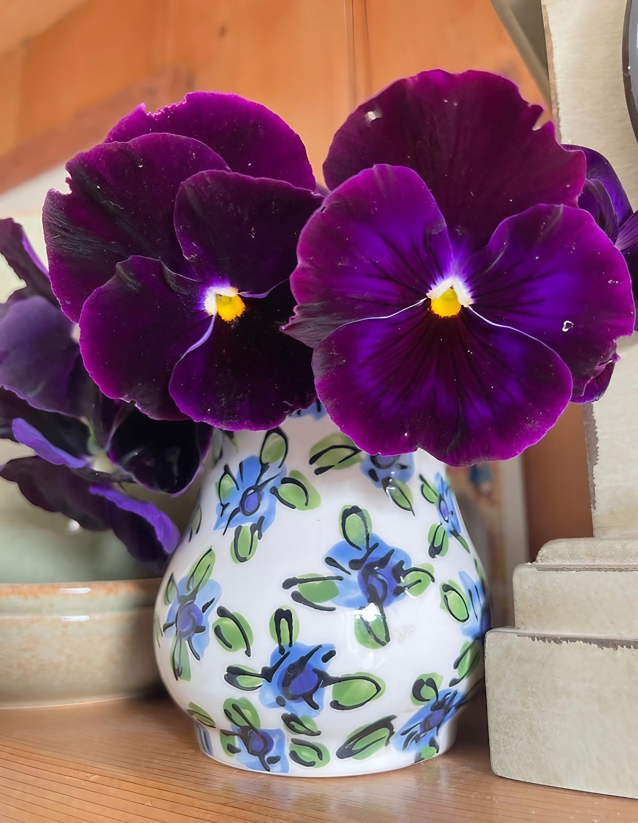 Pansy Swiss Giant Berna Velvet Blue displayed in a decorative vase indoors