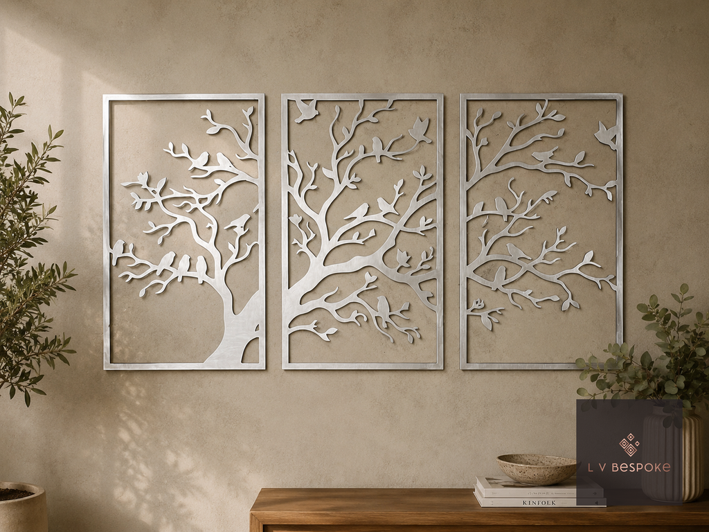 Three-panel metal tree wall art with love birds on a living room wall