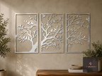 Three-panel metal tree wall art with love birds on a living room wall