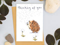 Thinking Of You Hedgehog Card – illustrated hedgehog blowing a dandelion clock