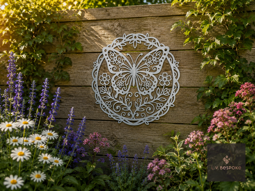 Round metal butterfly wall plaque on a fence behind flowers