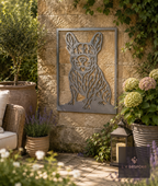 Framed metal French bulldog wall art on a stone courtyard wall