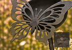 Metal garden stake with a small cup and butterfly cut-out
