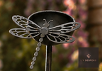Metal garden stake with a small cup and dragonfly cut-out