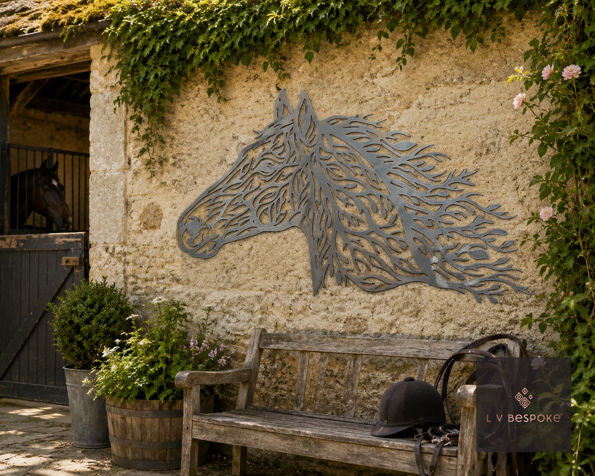 Metal horse head wall art on a stone wall above a bench