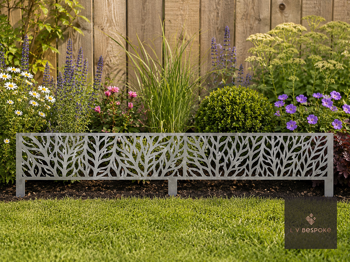 Decorative metal leaf-pattern lawn edging along a planted border
