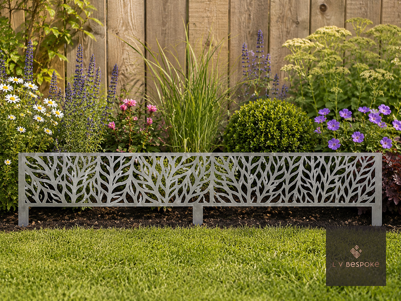 Decorative metal leaf-pattern lawn edging along a planted border