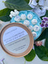 Rock Salt & Driftwood Botanical Wax Melts with water lily and driftwood scent, 12 vegan hand-poured soy wax melts in a decorative container.