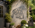 Geometric metal bear wall art on a garden wall