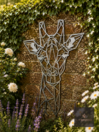 Geometric metal giraffe wall art on an ivy-covered wall