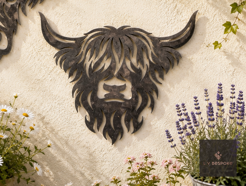 Metal Highland cow head wall art on a rendered wall