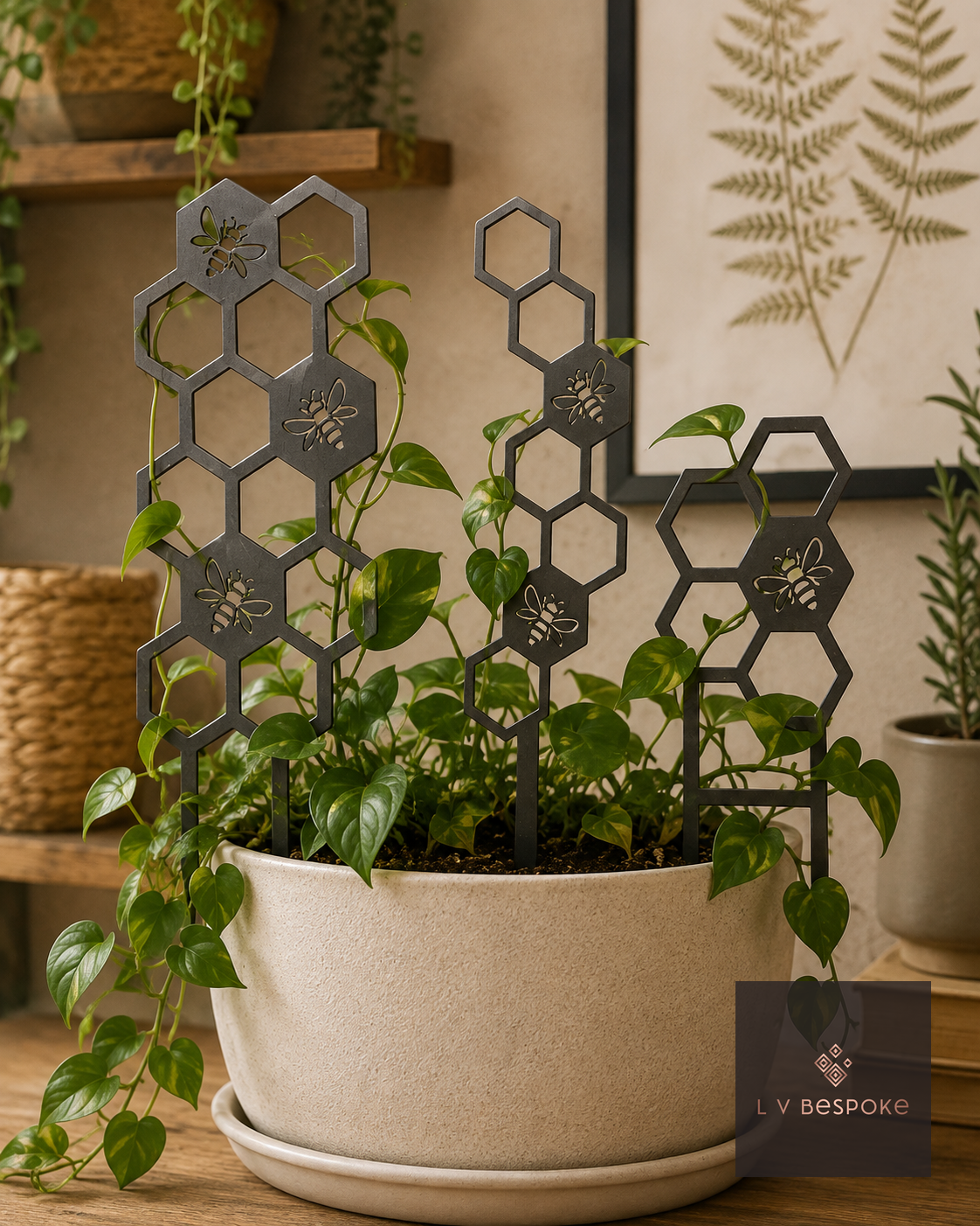 Honeycomb metal plant supports in a large cream pot