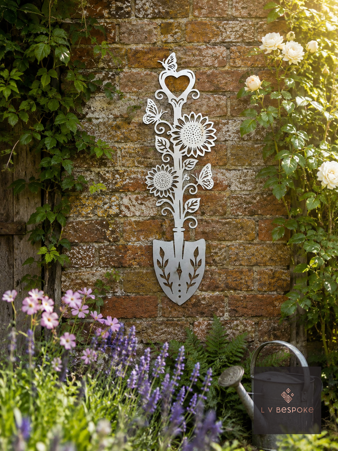 Metal spade-shaped floral wall plaque on a brick garden wall