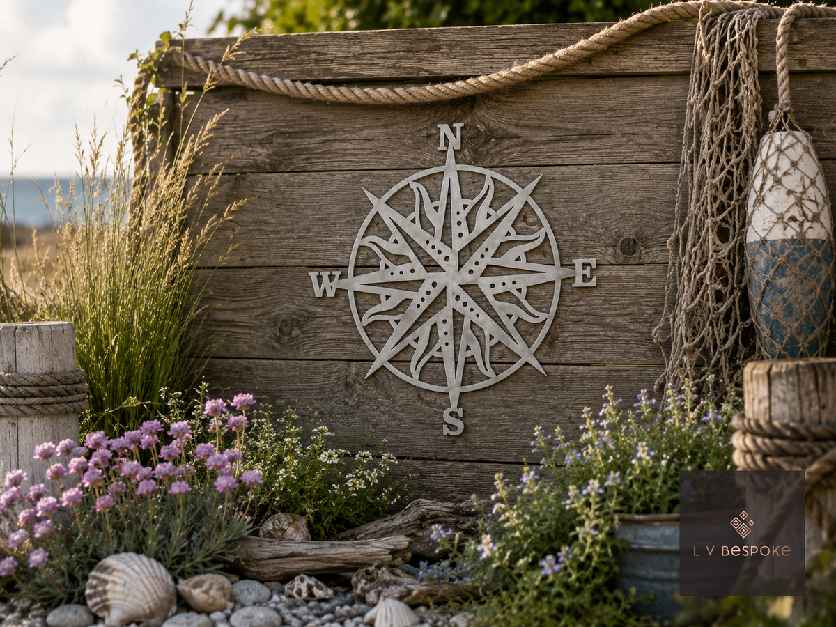 Metal compass rose wall art on a weathered wooden wall