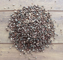 Dandy's Topsoil & Landscape Supplies Horticultural Grit—small, mixed-color stones—spread on wood, ideal for potting drainage.
