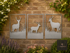 Three-panel metal deer wall art on a brick garden wall