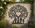 Metal family tree with heart wall art on a garden wall