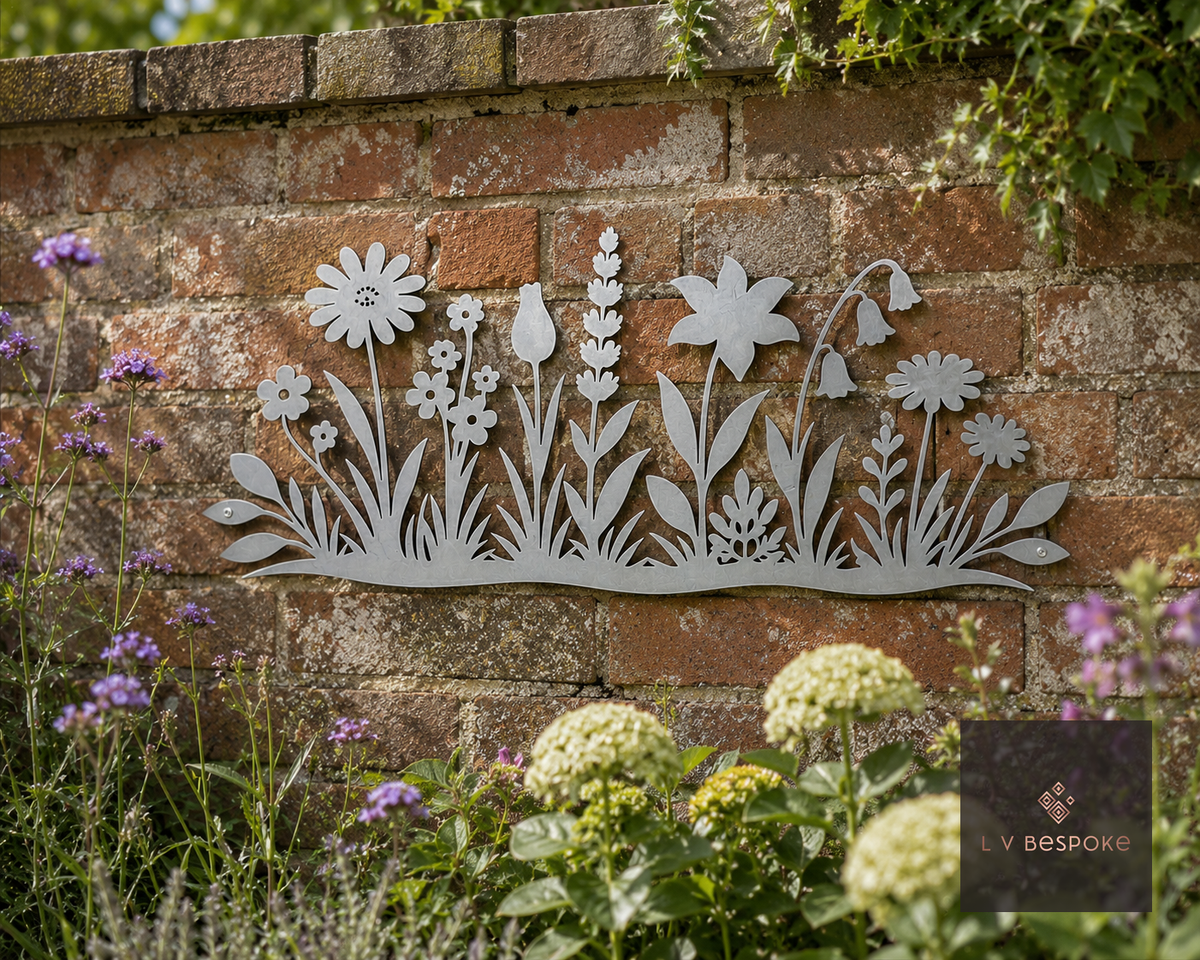 Metal wildflower meadow wall art on a brick wall