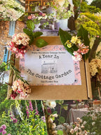The A Year in a Cottage Garden - Flower Box (24 Packs) by Bishy Barnabees Cottage Garden Ltd comes in a decorative box with cottage garden photos—ideal inspiration for using your own cut flower or cottage garden seed kit.