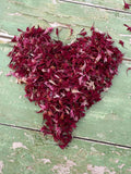 A bag of natural burgundy dried flower petals from Bishy Barnabees.