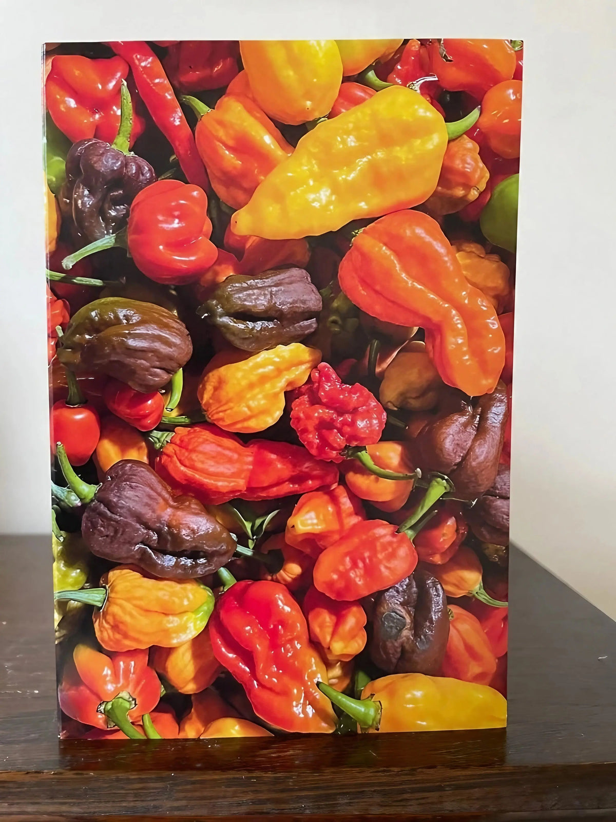 Chilli Rainbow Greeting Card – red, orange, yellow and purple chillies on wood