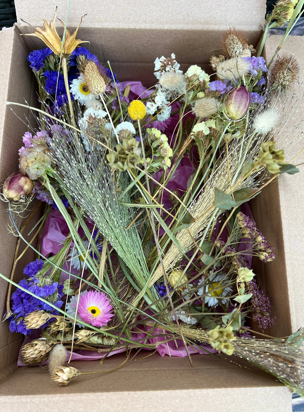 Dried Flower Craft Box contents – dried flowers and grasses in purple, white, yellow and pink