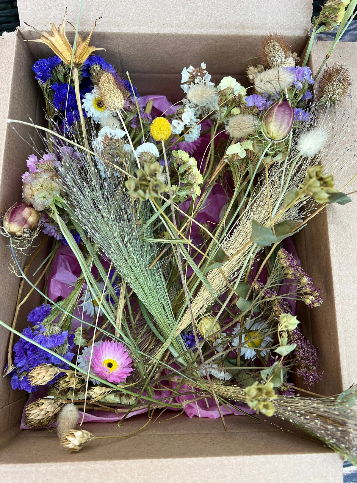 Dried Flower Craft Box contents – dried flowers and grasses in purple, white, yellow and pink