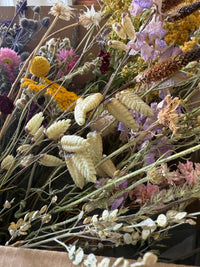 A close-up of the Dried Flower Craft Box by Bishy Barnabees Cottage Garden, showcasing colorful dried wildflowers and grasses in yellow, pink, purple, and cream—ideal for crafts or resin jewelry supplies.