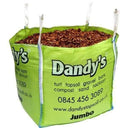 A large green bulk bag labeled Dandy's Topsoil & Landscape Supplies, filled with Hardwood Path Chips. The bag lists turf, topsoil, gravel, compost, a phone number, website, and "Jumbo" at the bottom.