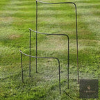 Three metal half-hoop plant supports in graduated sizes on a lawn