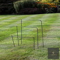 Metal half-hoop plant supports in three heights on a striped lawn