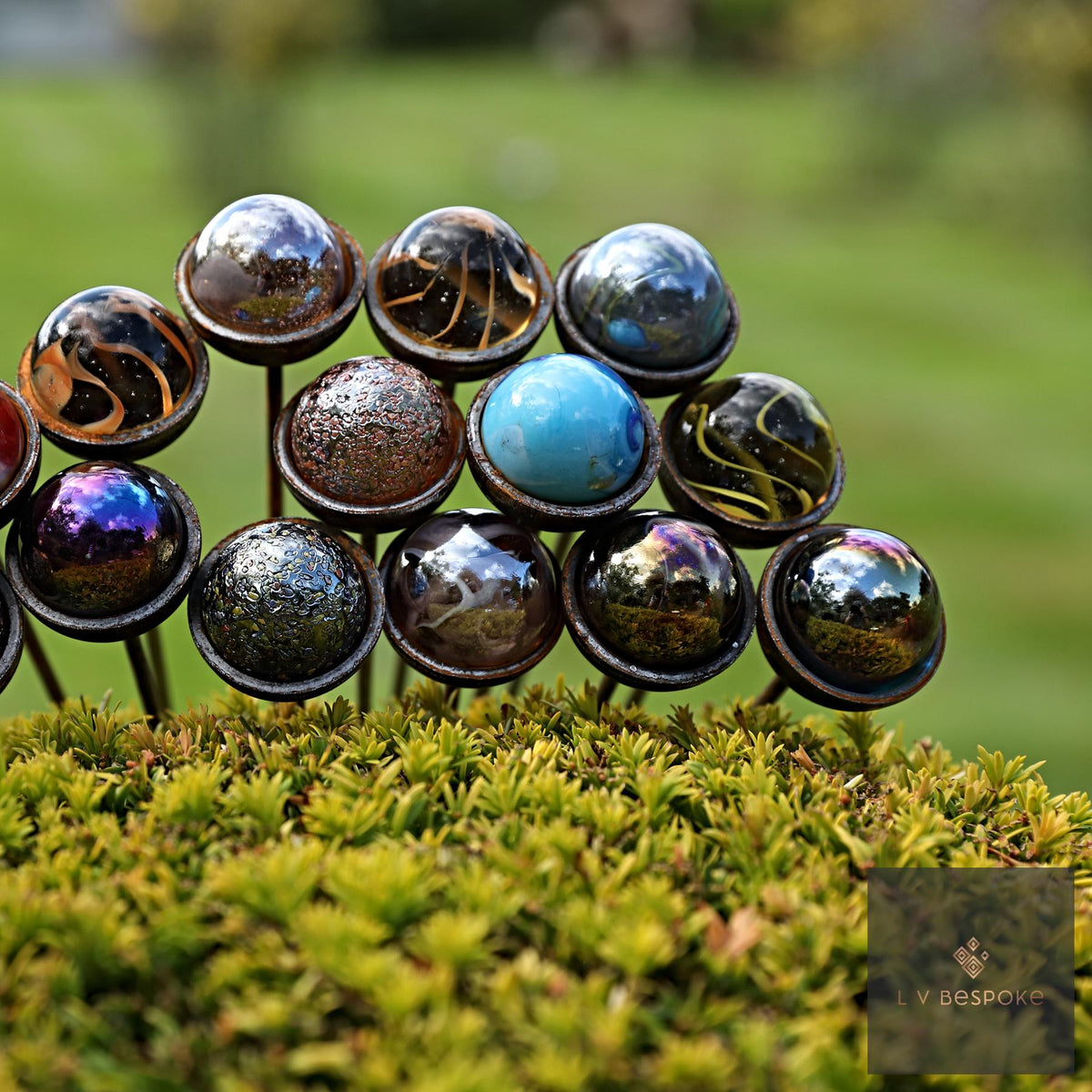 Cluster of metallic glass ball garden stakes