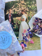 Larkspur Confetti in pink and purple spilling from blue packets over a wedding photo