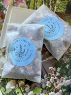 Two translucent Larkspur Confetti envelopes with blue Grown & Dried in Norfolk labels