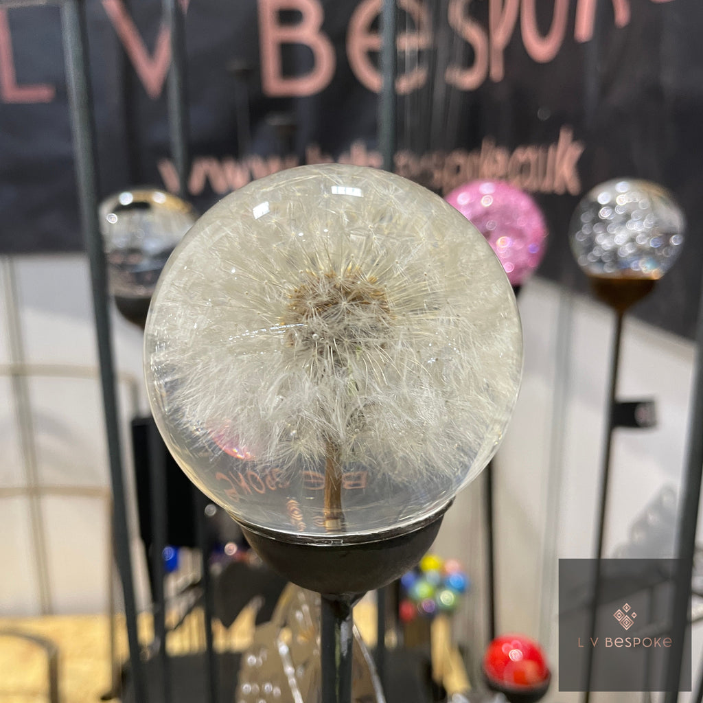 Close-up of the Lifelike Dandelion stake showing the white seed head inside a glass sphere