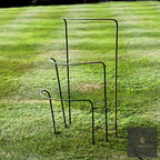 Four LV Bespoke curved steel plant supports in graduated sizes on a striped lawn