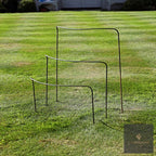 LV Bespoke wide curved steel plant supports standing on a mown lawn, side view