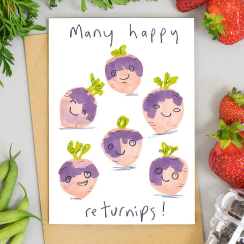 Many Happy Returnips Card – six smiling cartoon purple turnips, with strawberries beside the card