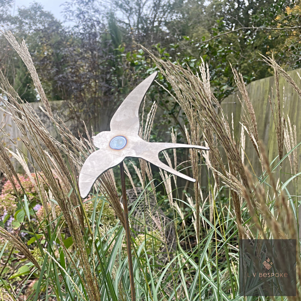 Swaying Garden Stakes – swallow among tall ornamental grasses