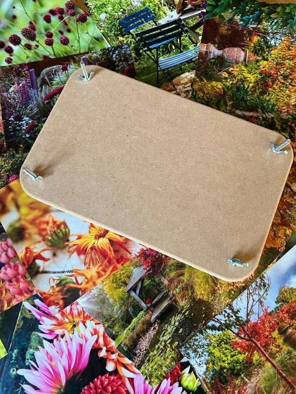 Wooden flower press base with bolts, surrounded by vibrant flower photos, ideal for preserving floral memories.